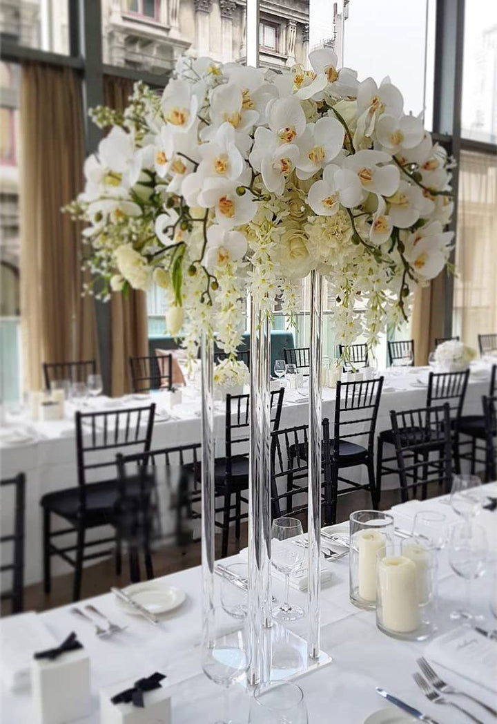 Clear Acrylic Plinth centrepiece with flowers on table