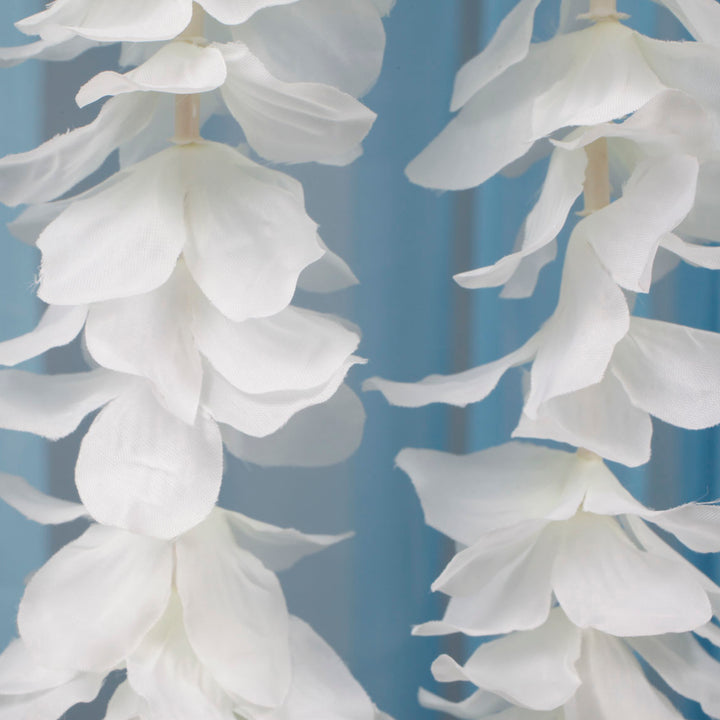 Close up of flower from large orchid hanging vine in ivory