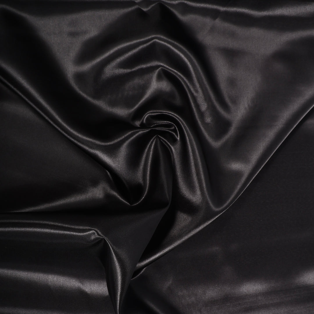 BLACK SATIN FABRIC ROLL CLOSEUP