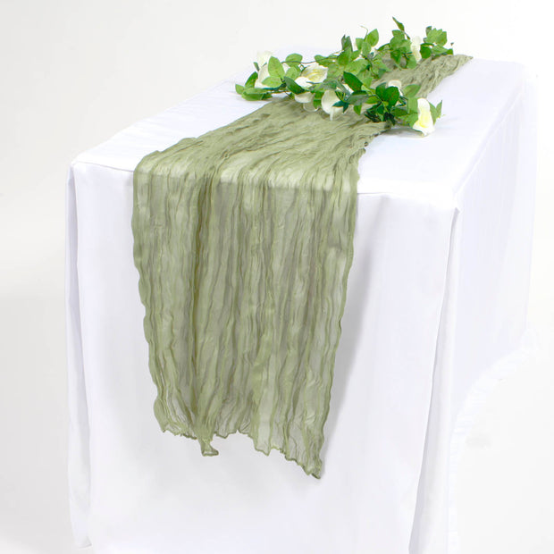 Sage Green Cheesecloth runner on white tablecloth with white rose vine.