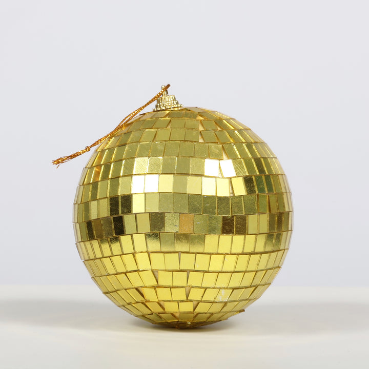 10cm Gold Disco Ball, sitting on table