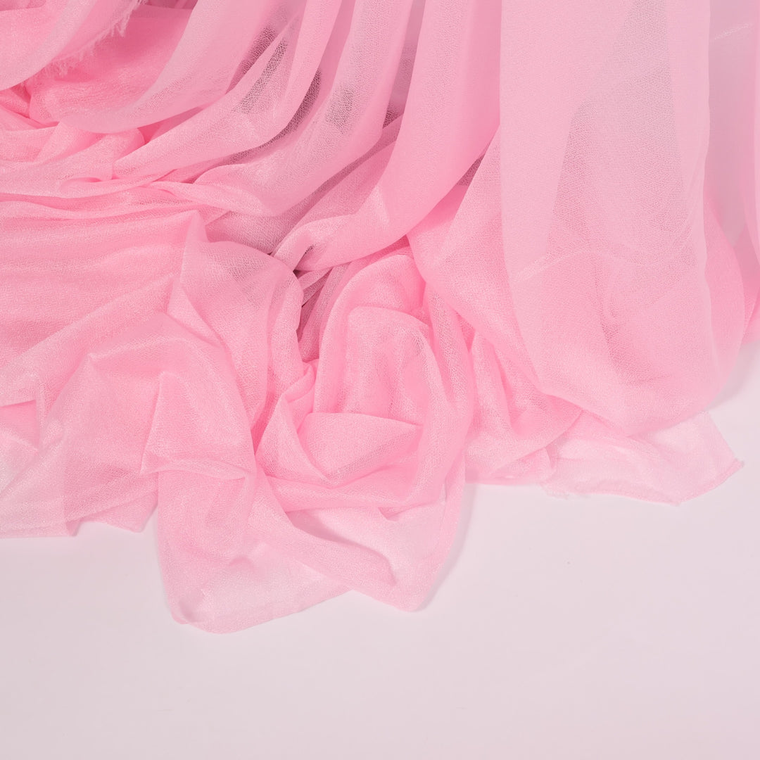Sheer Stretch Crepe Chiffon Fabric - Light Pink (1.6x28m) close up of material on floor