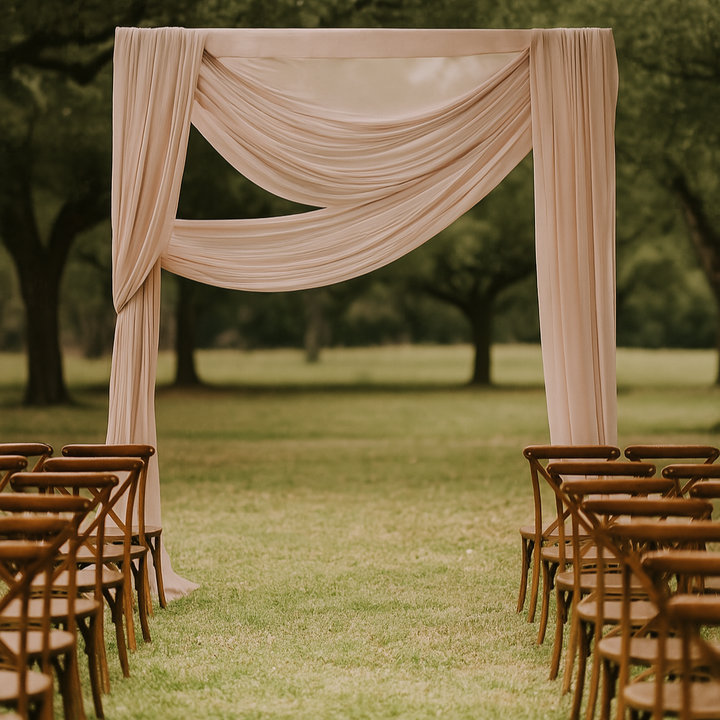 Taupe chiffon drape used at alter in outdoor wedding