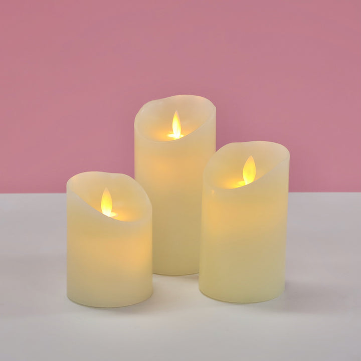 LED Flameless Flickering Wax Pillar Candle - Ivory, all 3 sizes turned on