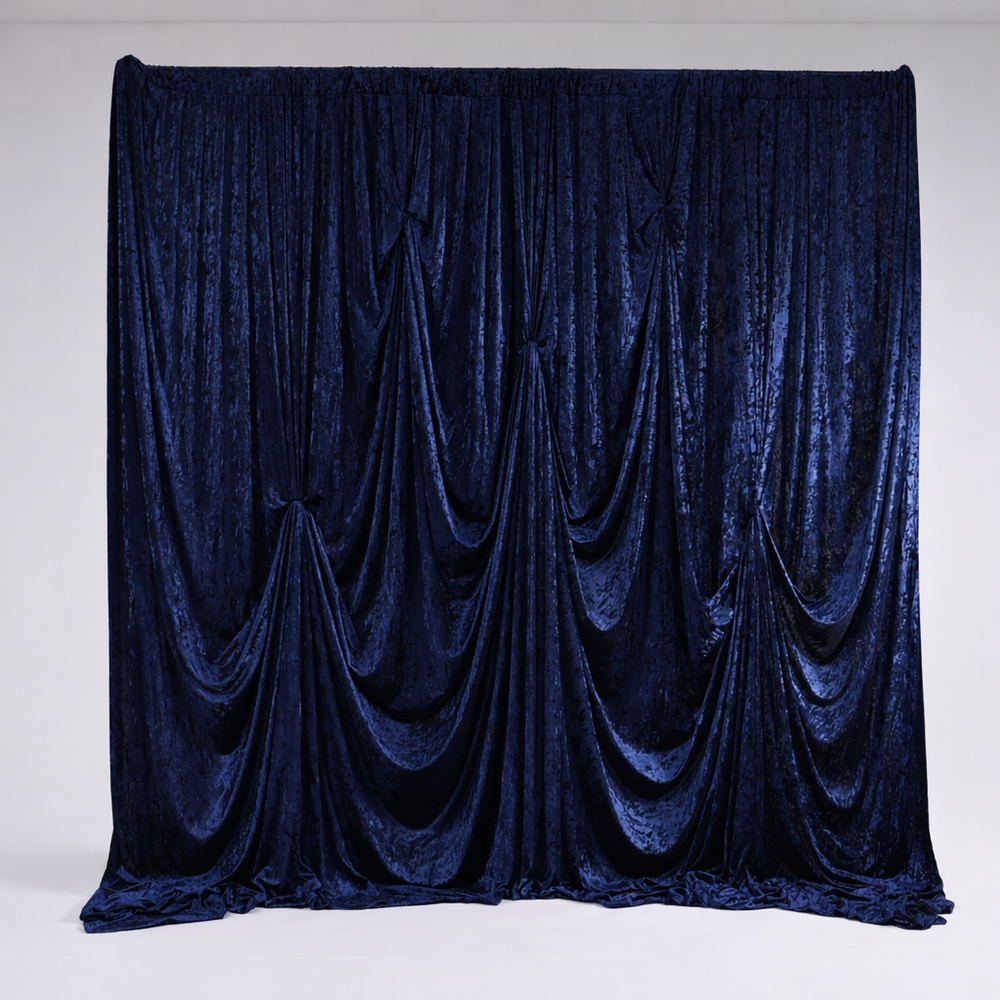 Navy velvet backdrop, gathered together at back with backdrop clamps