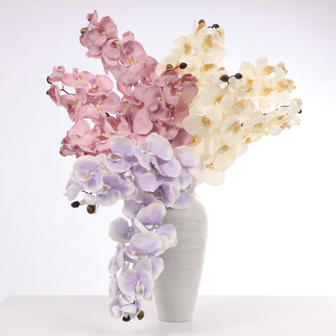 Orchid arrangement made from White/Ivory, Mauve and Lavender stems in Textured Centrepiece Urn Shaped Vase - Light Grey (18x34cm)