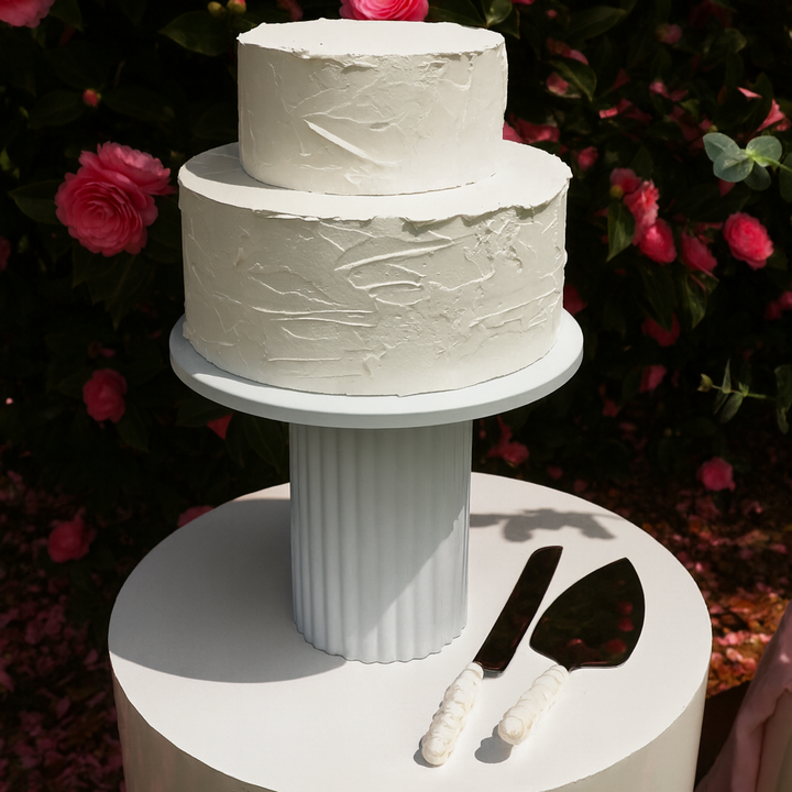 Ribbed cake stand on round plinth with bubble hand knife server set in silver