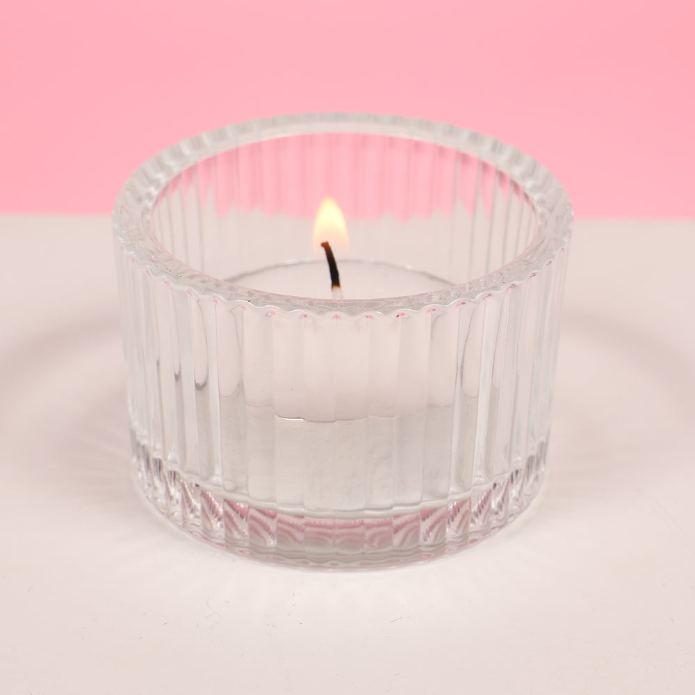 Ribbed Glass Tea Light Candle Holder with candle (side view)