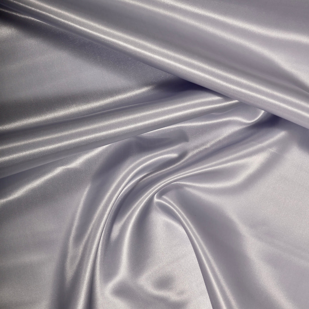 SILVER SATIN FABRIC ROLL CLOSEUP
