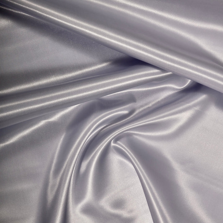 SILVER SATIN FABRIC ROLL CLOSEUP