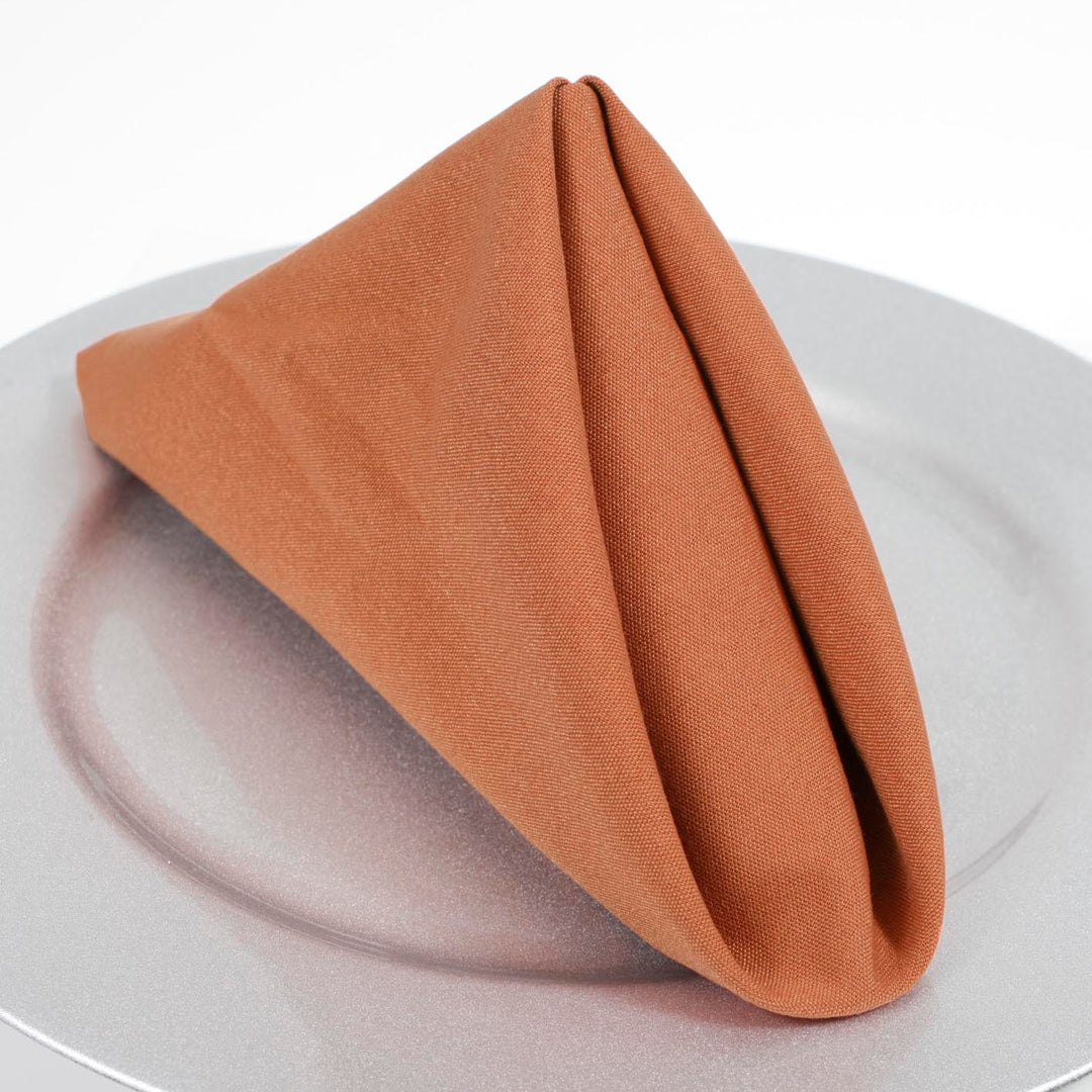 SPUN POLY Napkins - Terracotta (50x50cm) folded on plate