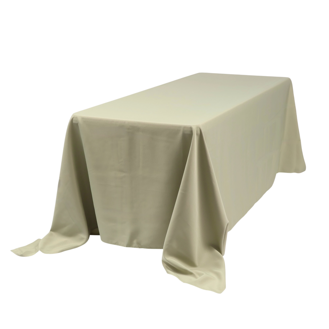 Sage 220x330cm Tablecloth displayed on a 6ft trestle table