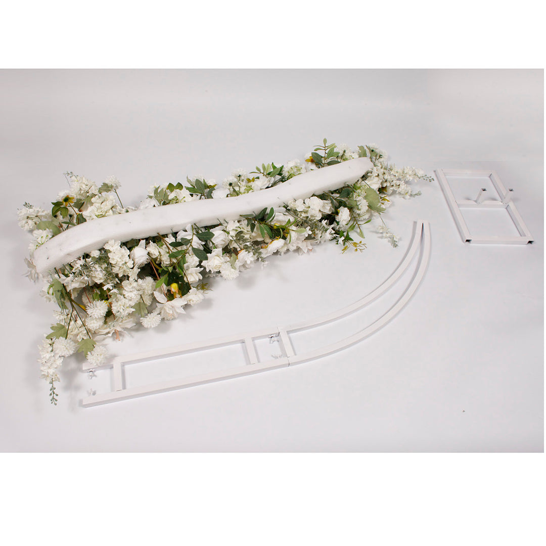 Disassembled Crescent Arch Flower Frame and one flower panel laying flat on ground