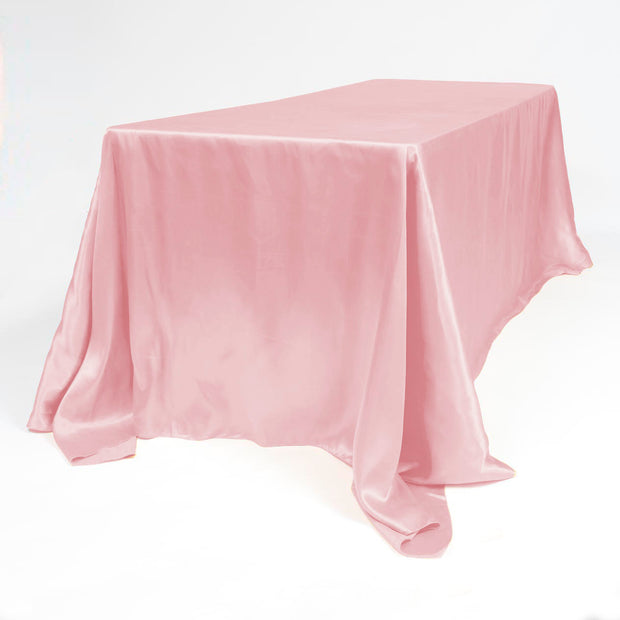 Floor Length Blush Pink Satin Table Cloth on White background on table