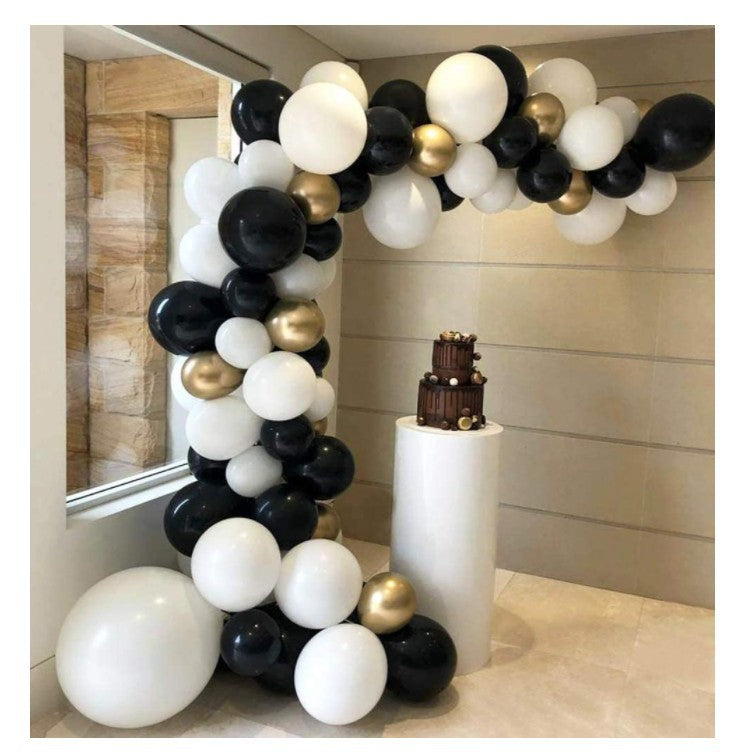 Black gold white Balloon garland setup with white plinth Cake stand