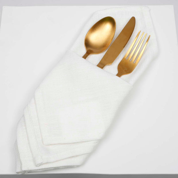 White Linen Napkin folded with Gold cutlery inserted
