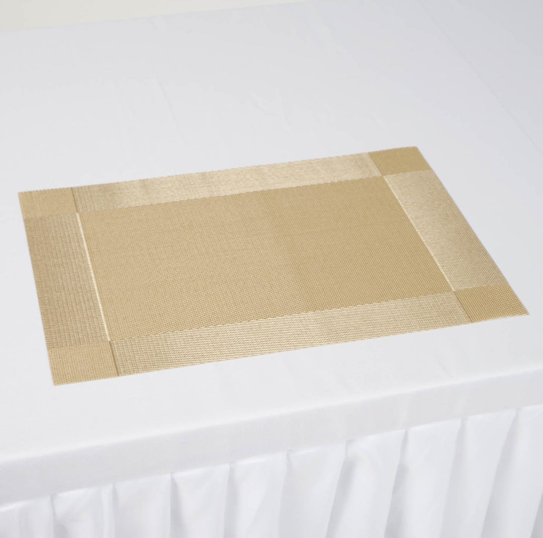 Gold Placemat on white tablecloth